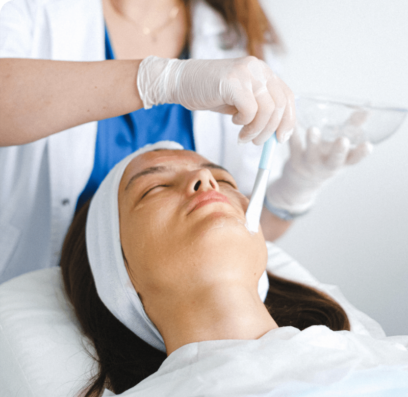 Woman having face treatment